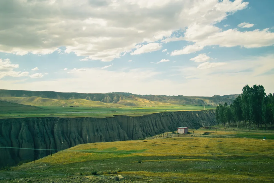 Layered canyon walls framing a winding valley
